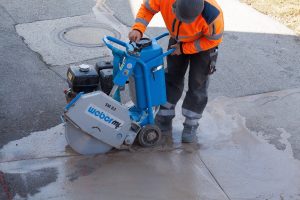 Construction worker using very loud equipment